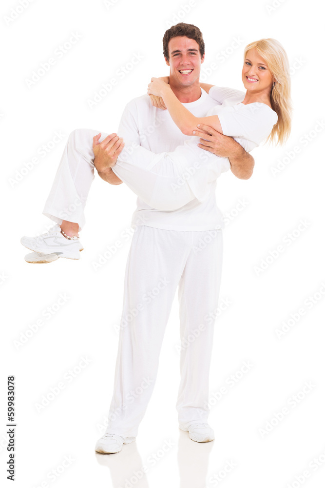 man carrying girlfriend in his arms