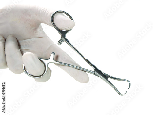 towel clip in a hand with rubber glove