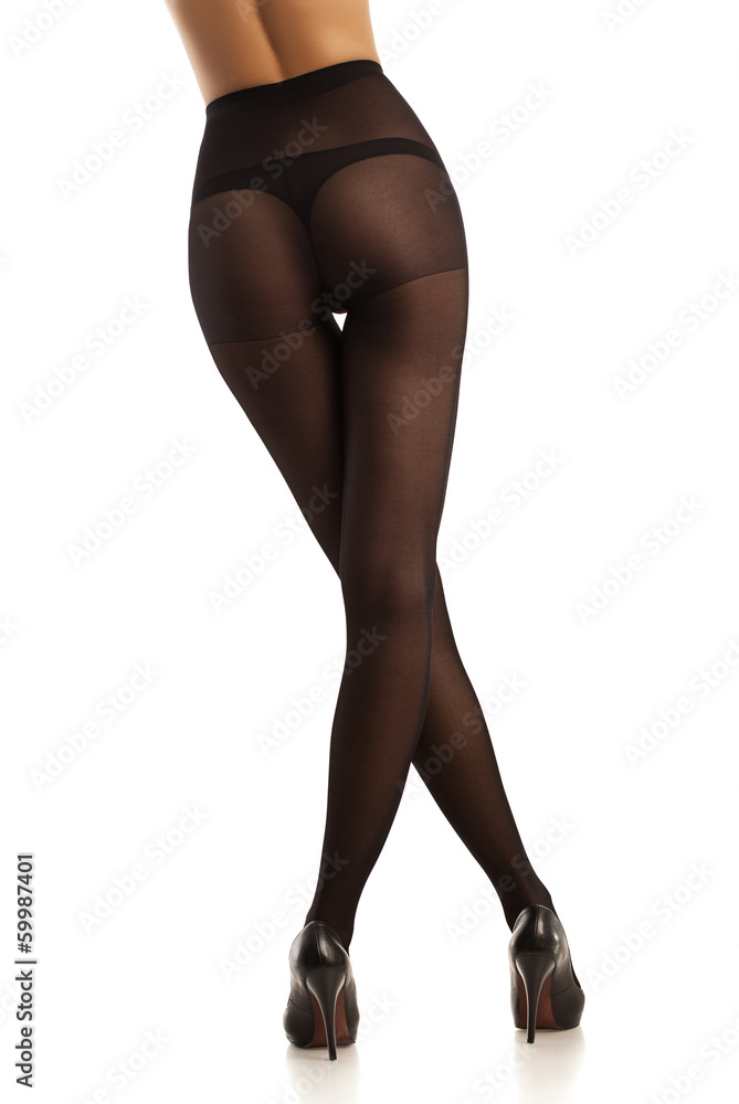 Beautiful girl in black pantyhose. Isolated. White Beautiful girl in black pantyhose. Isolated. White