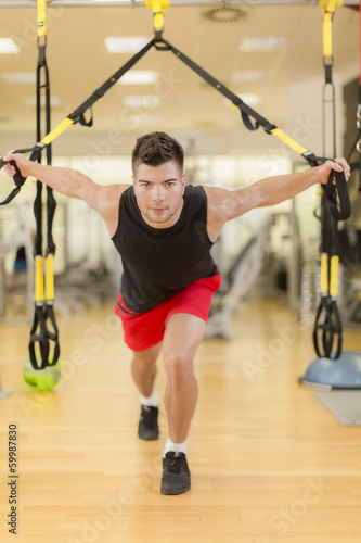 Young man training in the gym © BGStock72