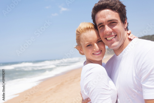 young couple relaxing on beach