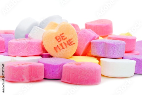 Pile of Valentines Day candies with BE MINE message