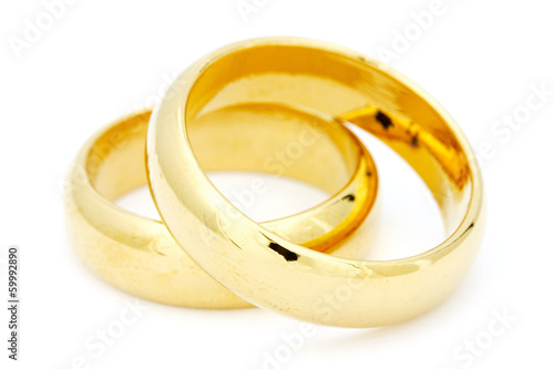 Two golden wedding on white