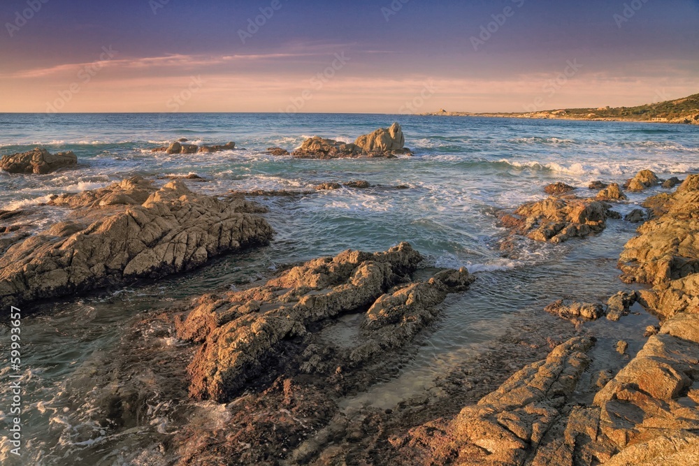 Coriscan rocks in sea at dusk