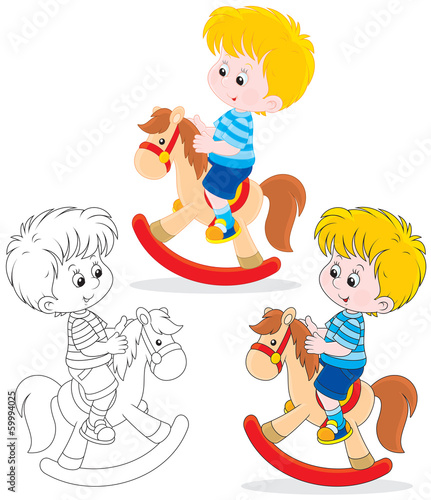Boy riding on a toy horse
