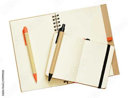 Opened notebooks and pens
