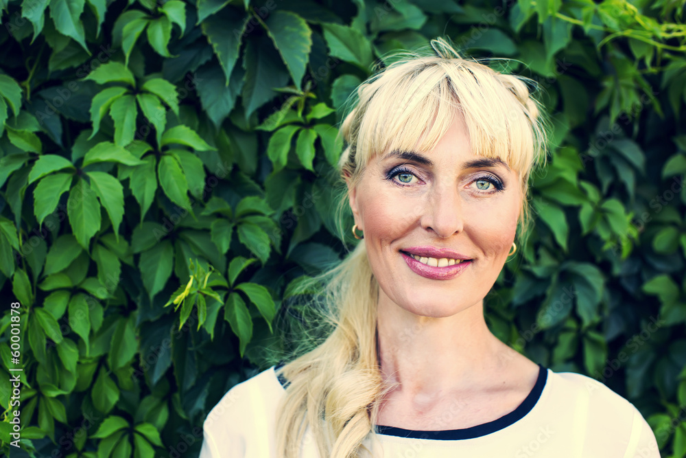 Portrait of an adult woman in nature summer Portrait of an adult woman in nature summer