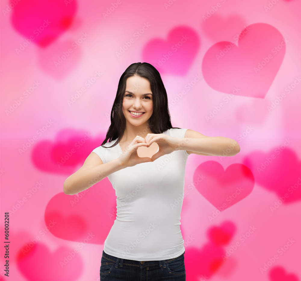 smiling girl showing heart with hands smiling girl showing heart with hands