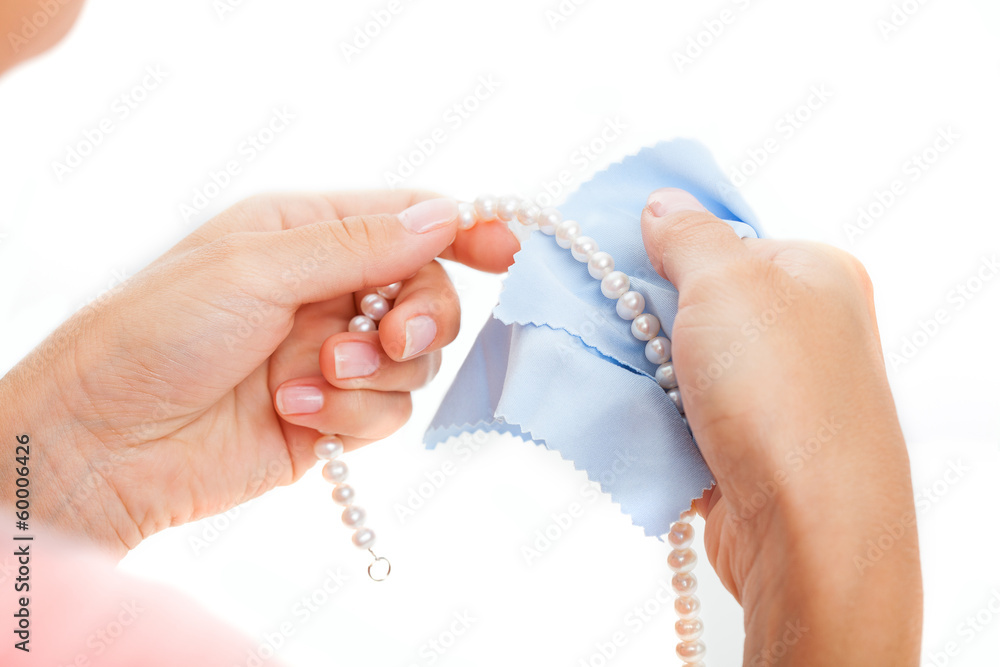 Woman polishing pearls