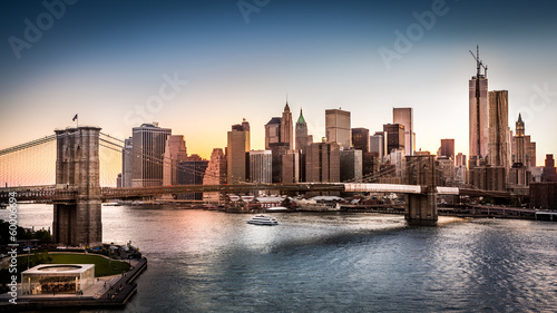 Brooklyn Bridge and the Lower Manhattan at sunset in NY City