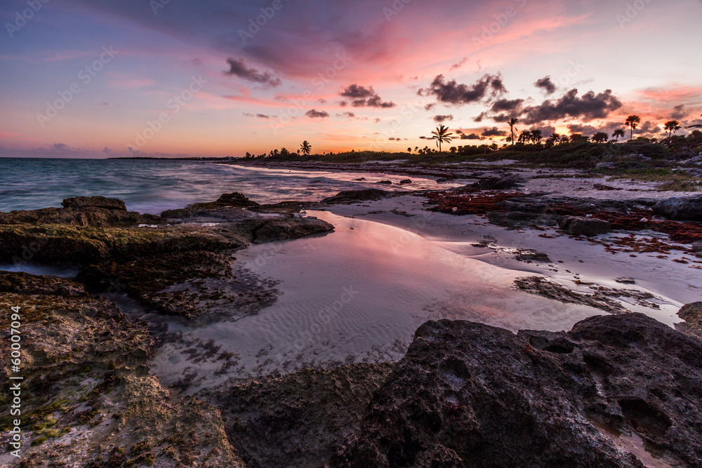 Purple sunset over a tropical rocky beach, Riviera Maya, Mexico