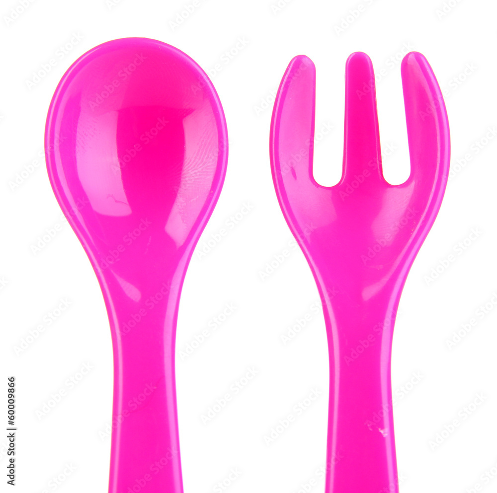 Pink fork and spoon for baby food isolated on white Pink fork and spoon for baby food isolated on white
