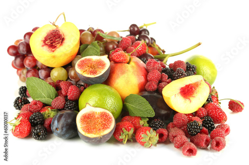 Assortment of juicy fruits and berries  isolated on white