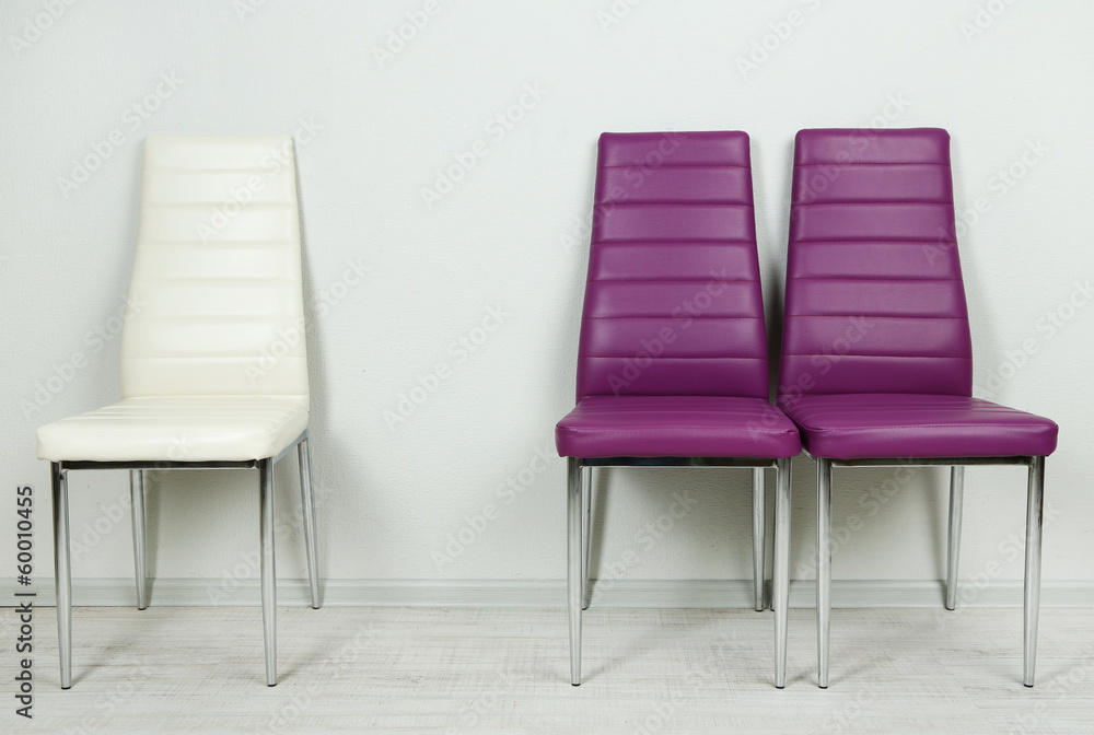 Obraz premium Modern color chairs on wall background