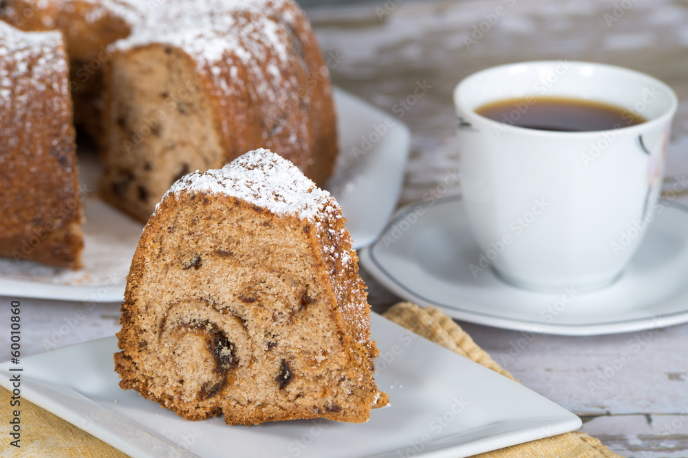 Slice of homemade bundt cake with prunes and spices Slice of homemade bundt cake with prunes and spices