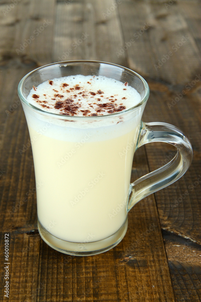 Cup of eggnog on wooden background Cup of eggnog on wooden background