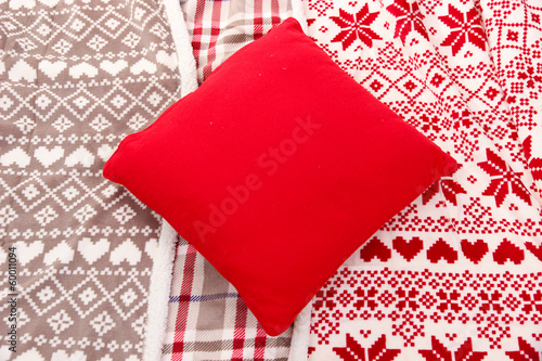 Warm plaids and pillow close-up background