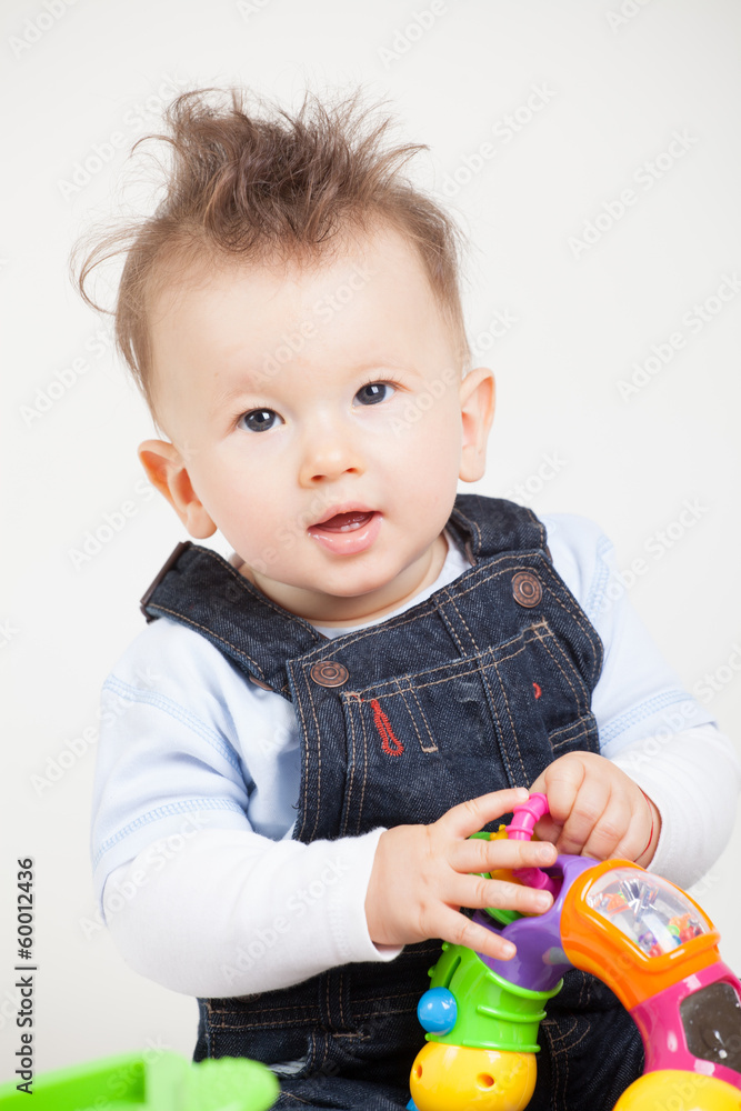 cute smiling baby with fancy haircut in studio cute smiling baby with fancy haircut in studio