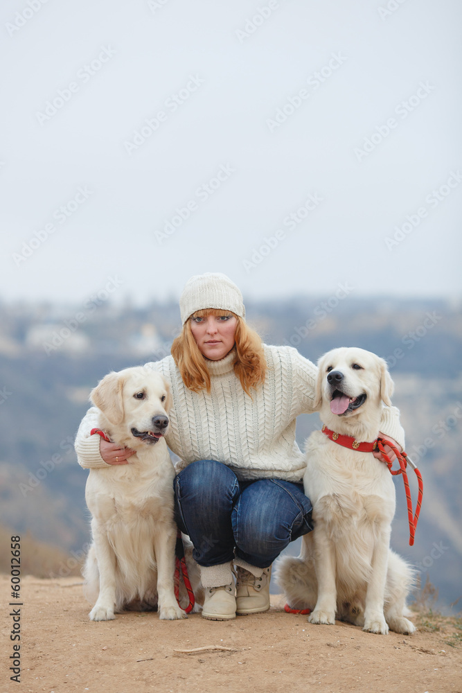 Beautiful girl with her dog near sea