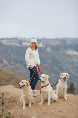 Beautiful girl with her dog near sea