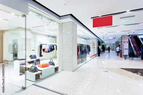 Boutique display window with mannequins in fashionable dresses