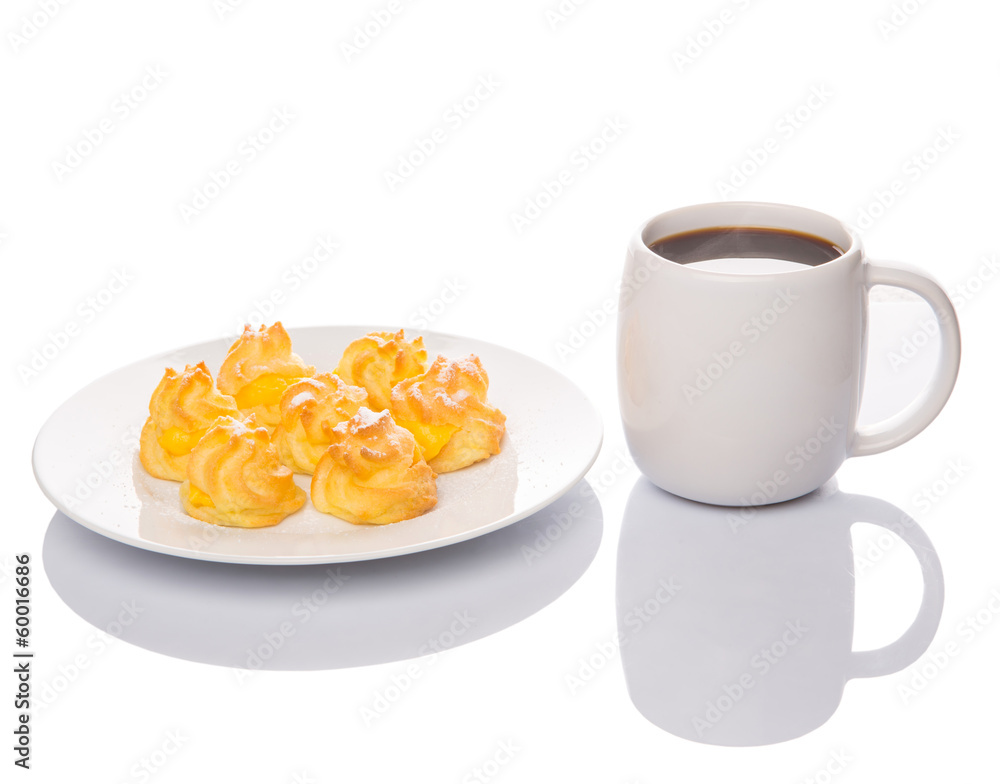 Homemade cream puff and a mug of coffee Homemade cream puff and a mug of coffee