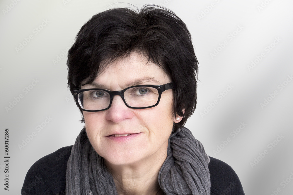 Portrait of a woman with glasses in middle age Portrait of a woman with glasses in middle age