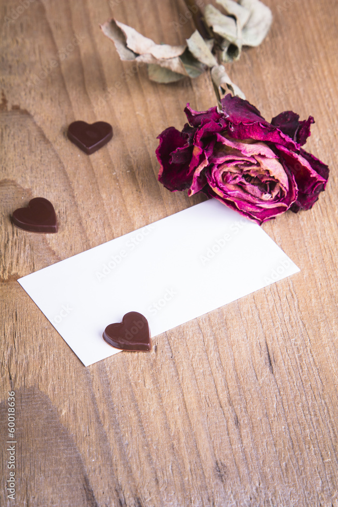 the dried rose, blank business card and chocolate hearts the dried rose, blank business card and chocolate hearts