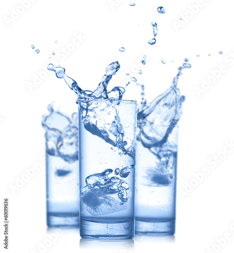 Water splash in glasses isolated on white