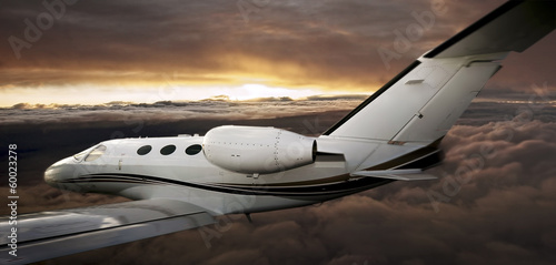 Executive in flight at sunset