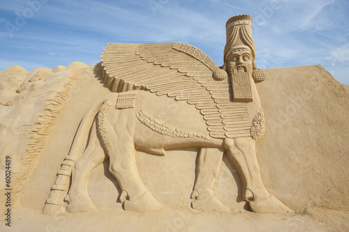 Sand sculpture of Lamassu deity photo