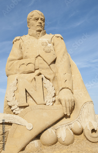 Sand sculpture of emperor napoleon against blue sky