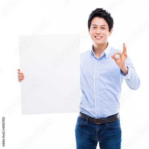 Young Asian man showing a pannel card