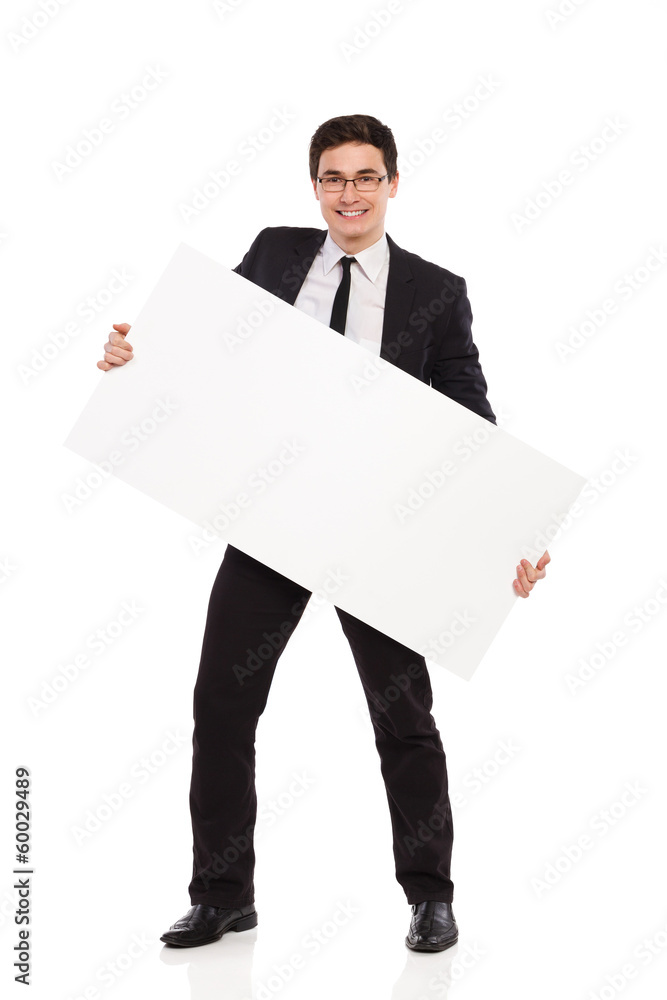 Happy male office worker standing with placard. Happy male office worker standing with placard.