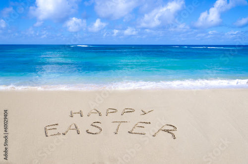 Sign "Happy Easter" on the beach