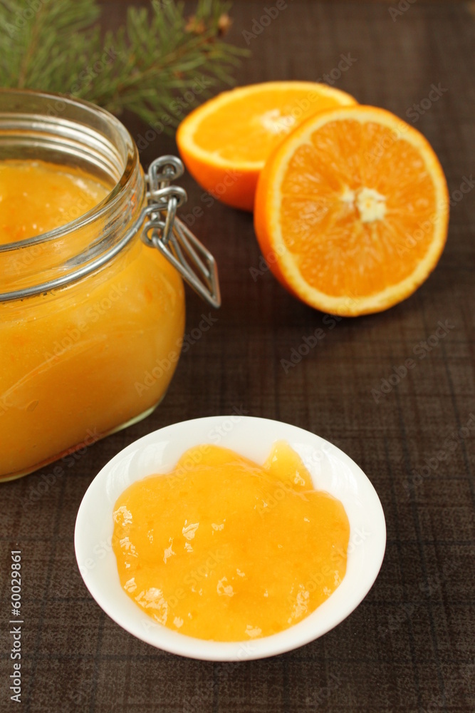 oranges jam in a glass jar on a table oranges jam in a glass jar on a table