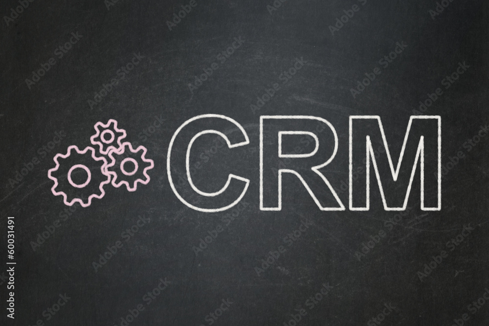 Obraz premium Finance concept: Gears and CRM on chalkboard background