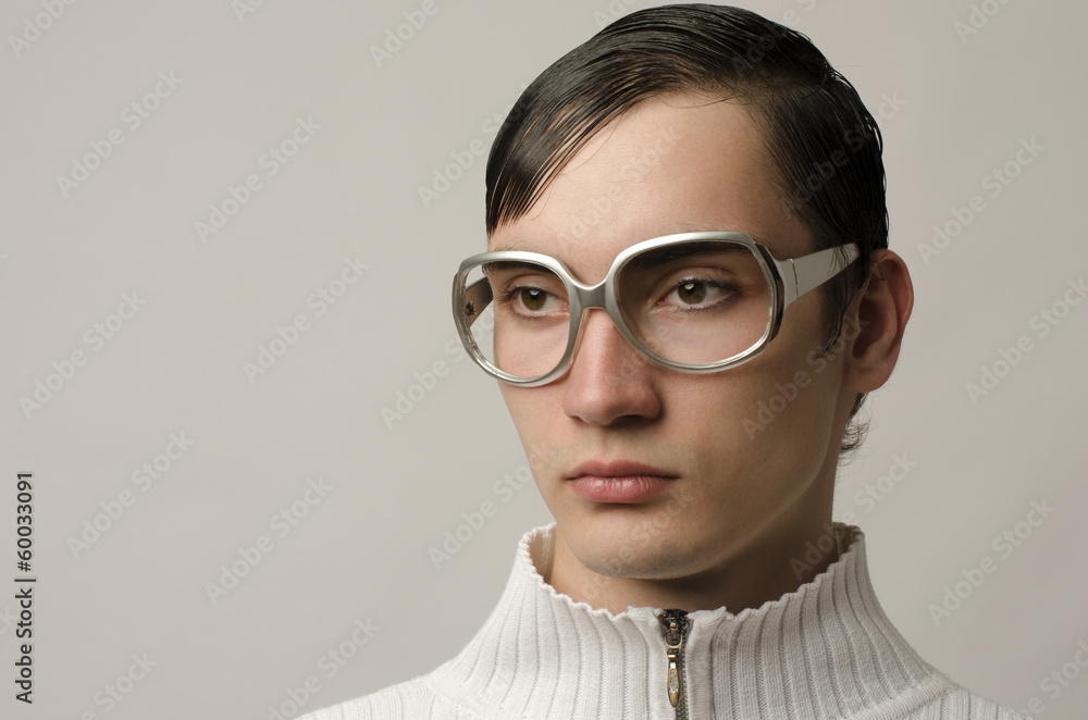 Beautiful man wearing eyeglasses and looking like a geek