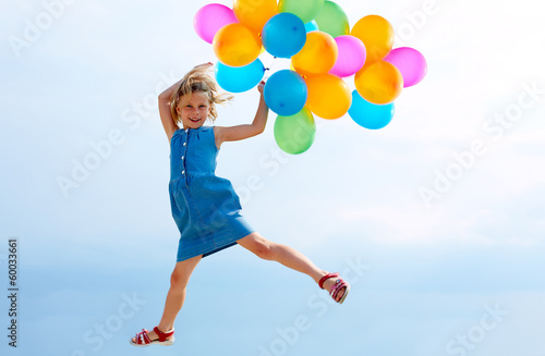 Jumping with balloons © natasnow