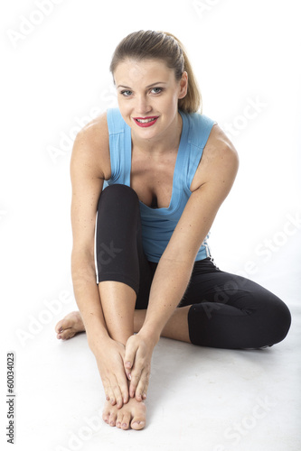 Woman Massaging Ankle