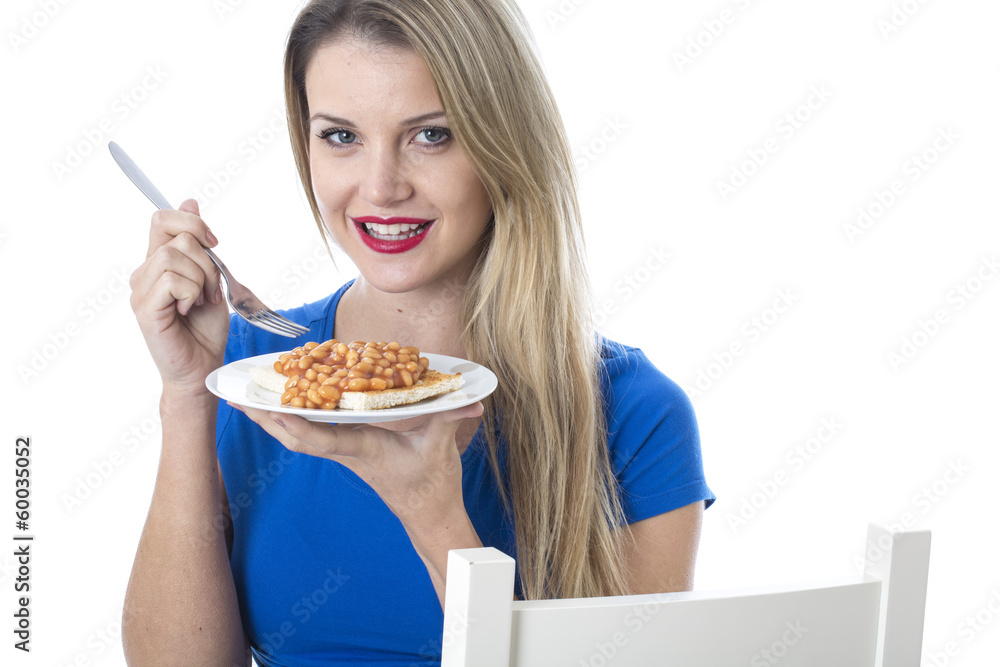 Young Woman Eating Baked Beans on Toast Young Woman Eating Baked Beans on Toast