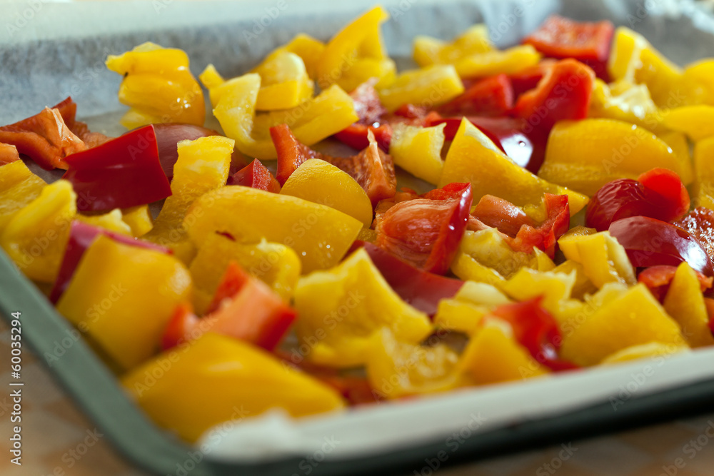 Mix red and yellow peppers cut into pieces and put into the pan.
