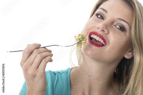 Young Woman Eating Spinach and Pine Nut Pasta