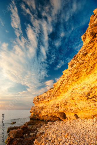 Coastal cliffs and the beach at sunset