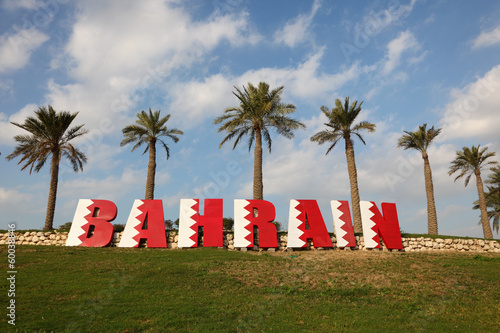 Bahrain sign under Palm Trees in Manama photo