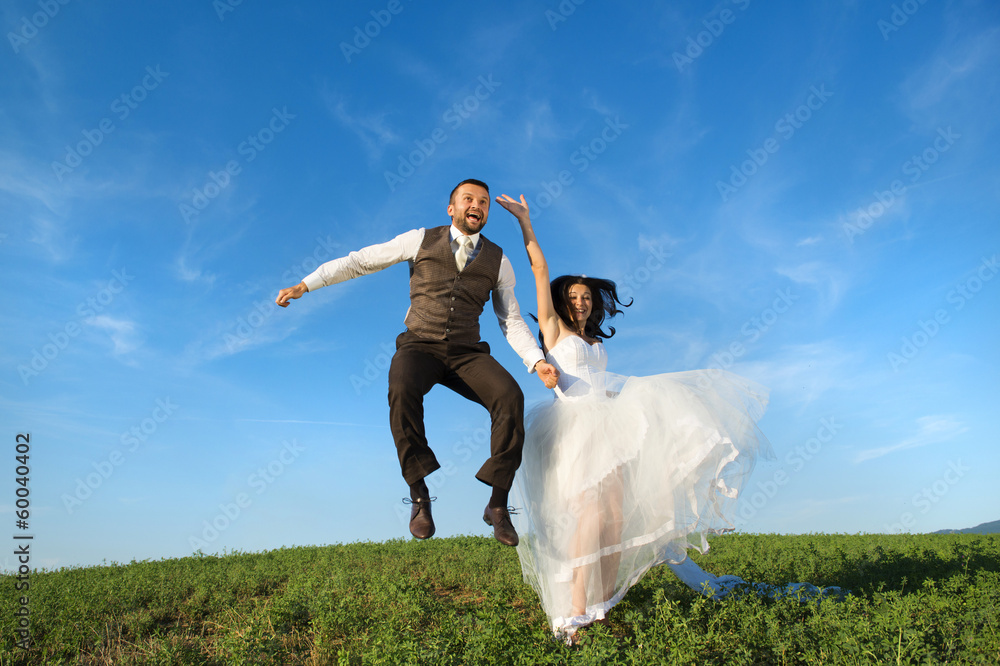 Newly married couple portrait with blue sky