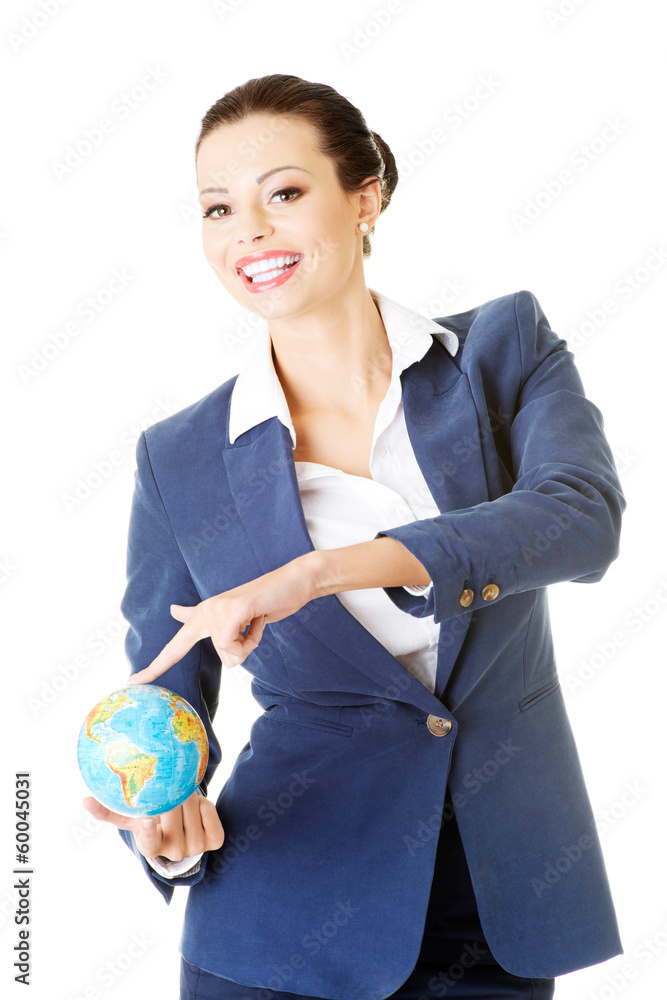 Young business woman holding small globe.