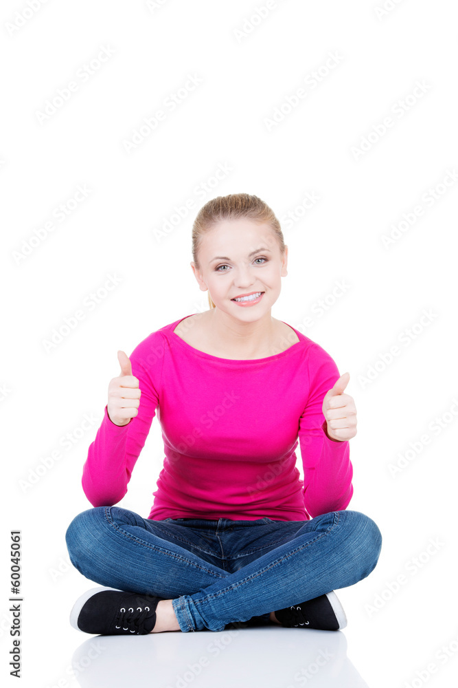 young casual woman student showin OK gesture. young casual woman student showin OK gesture.