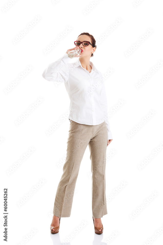 Beautiful business woman with plastic bottle of water. Beautiful business woman with plastic bottle of water.