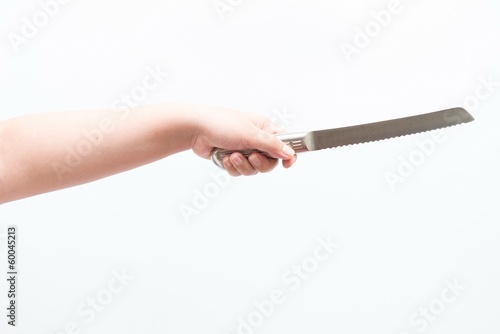 Asian woman holding large knife